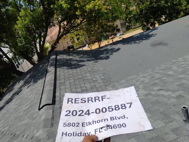 residential shingle roof replacement by Hloska Roofing in Holiday